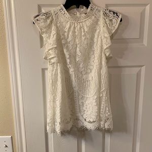 NEW with TAGS- Sweet Lovely white lace top with flutter sleeves.  Size small.
